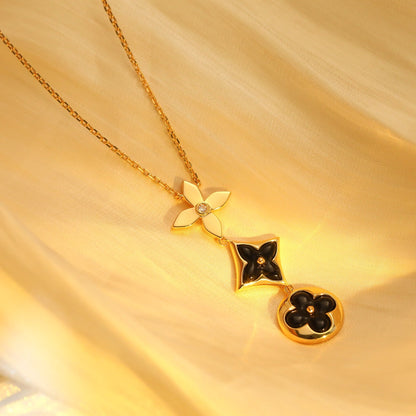 [moco jewelrys] Halskette aus Onyx, Stern und Sonne, roségolden