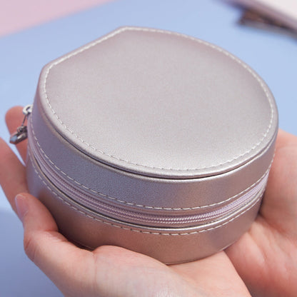 Runde Schmuckschatulle aus Leder, tragbar, ideal für Reisen und zur Aufbewahrung von Schmuck.