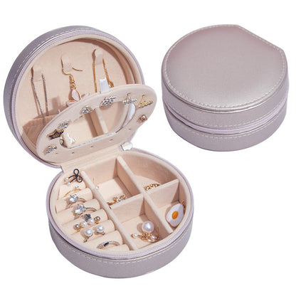 Runde Schmuckschatulle aus Leder, tragbar, ideal für Reisen und zur Aufbewahrung von Schmuck.