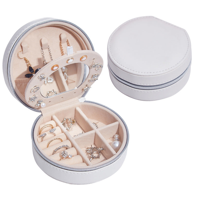 Runde Schmuckschatulle aus Leder, tragbar, ideal für Reisen und zur Aufbewahrung von Schmuck.