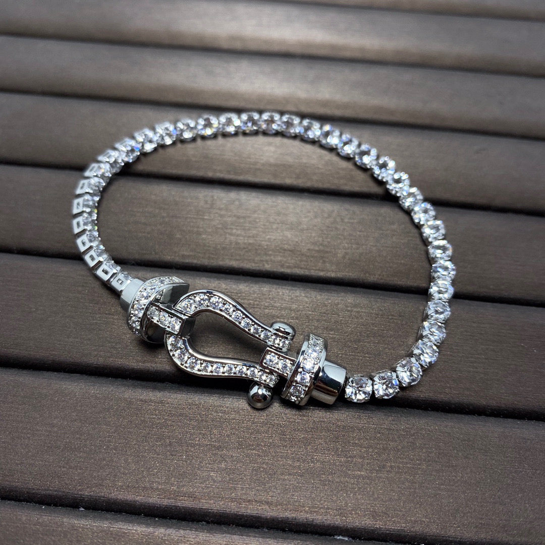 [moco jewelrys] Großes Horseshoe Tennisarmband mit Diamanten 