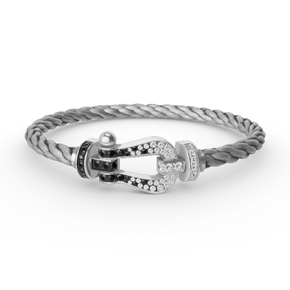 [moco jewelrys] Großes Hufeisenarmband mit schwarzen und weißen Diamanten, Silber