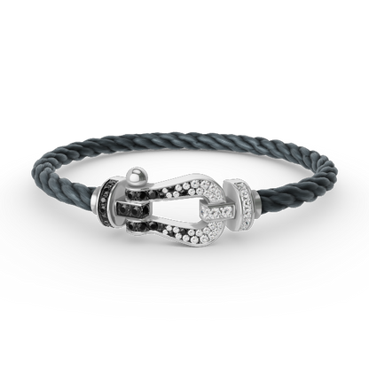[moco jewelrys] Großes Hufeisenarmband mit schwarzen und weißen Diamanten, Silber