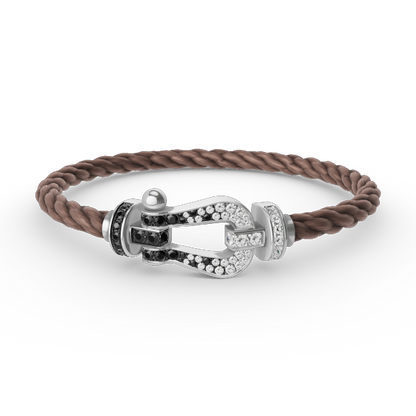 [moco jewelrys] Großes Hufeisenarmband mit schwarzen und weißen Diamanten, Silber