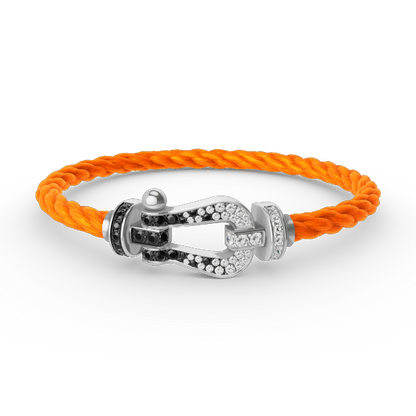 [moco jewelrys] Großes Hufeisenarmband mit schwarzen und weißen Diamanten, Silber