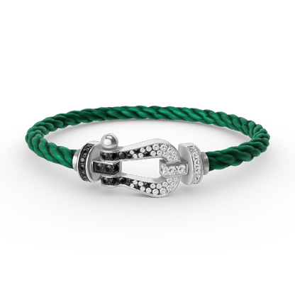 [moco jewelrys] Großes Hufeisenarmband mit schwarzen und weißen Diamanten, Silber